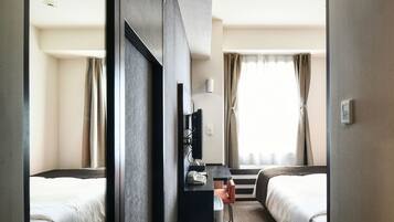 Down duvets, desk, laptop workspace, blackout curtains