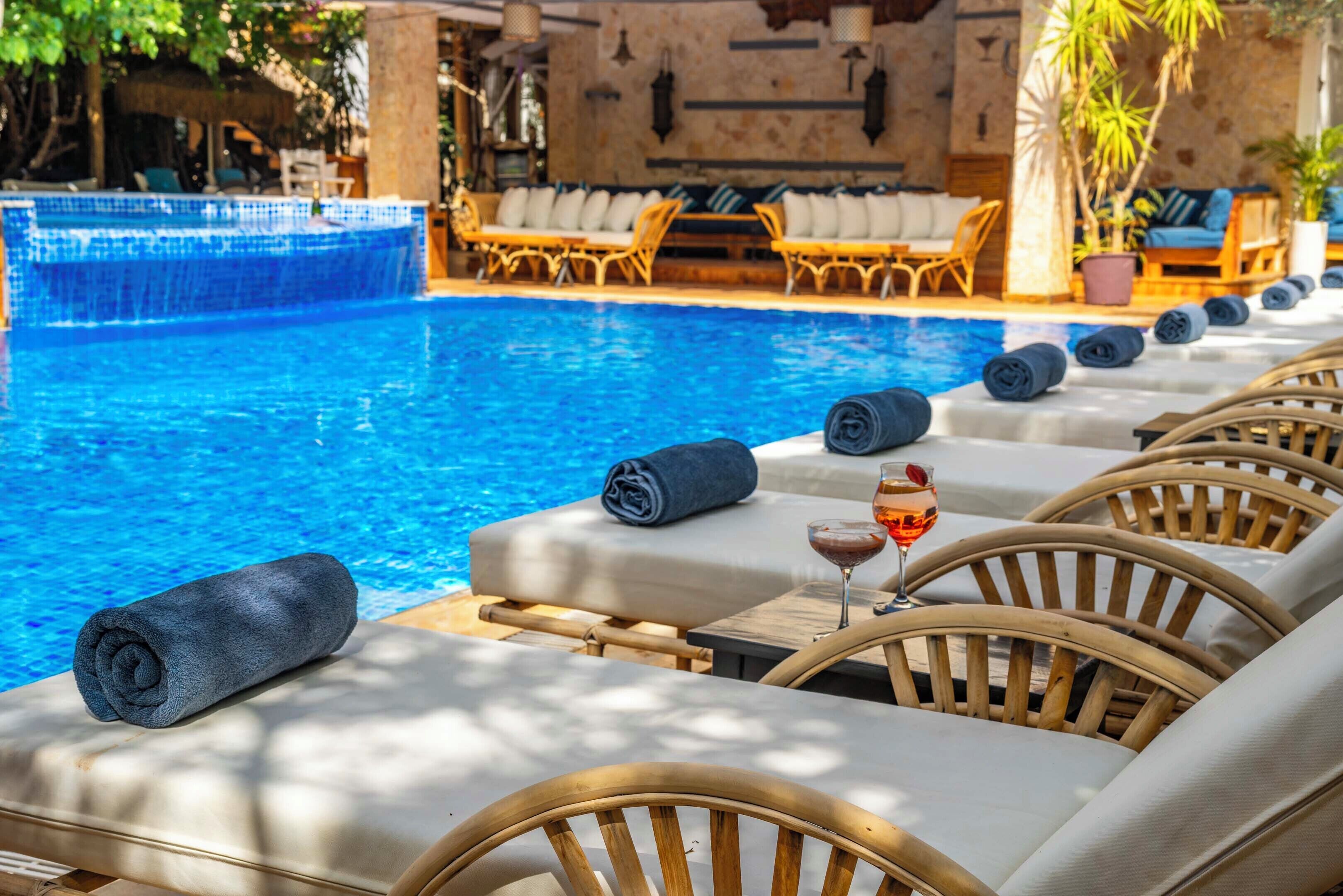 seasonal outdoor pool, free pool cabanas, pool umbrellas