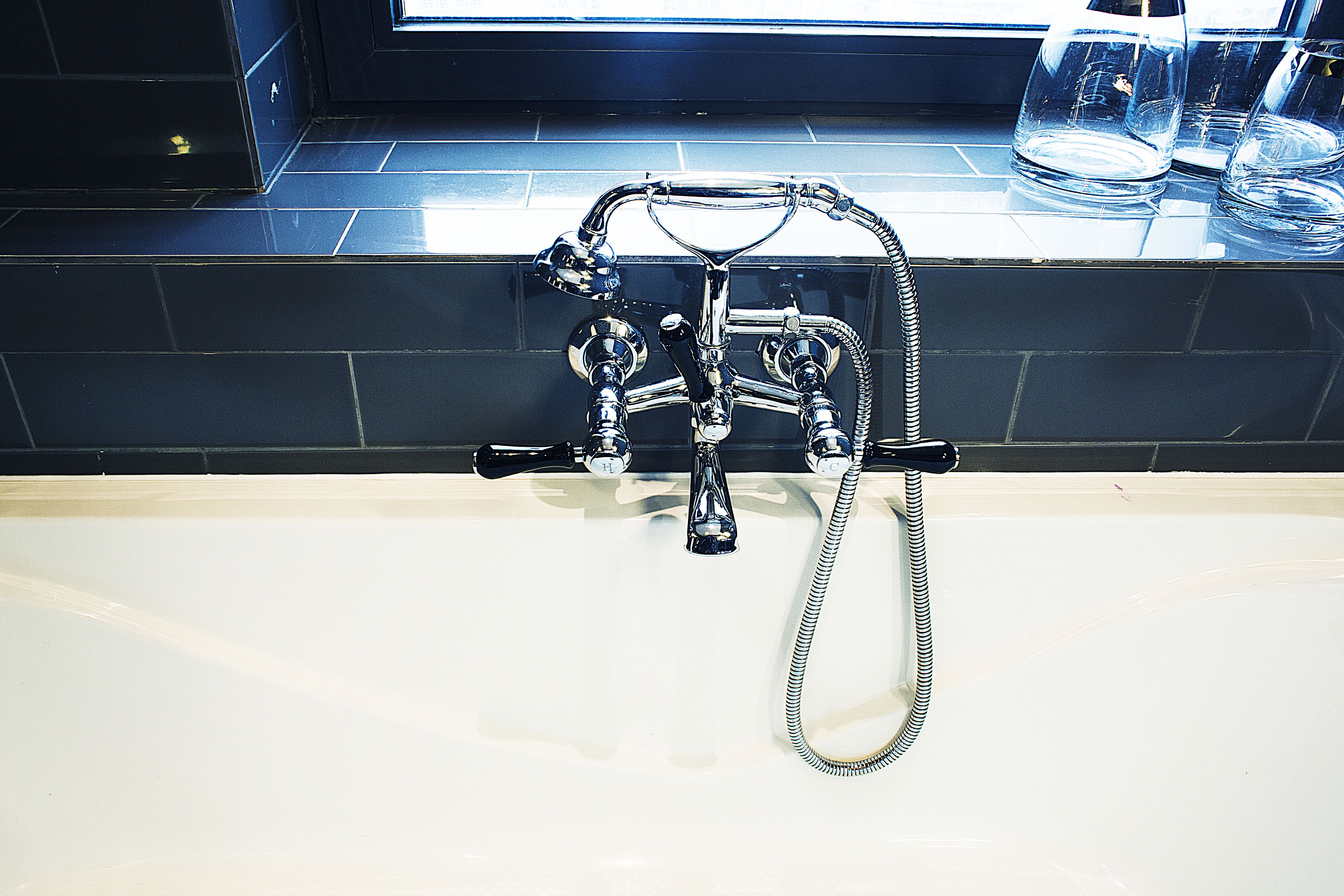 deluxe double room | bathroom | rainfall showerhead, free toiletries, hair dryer, bathrobes