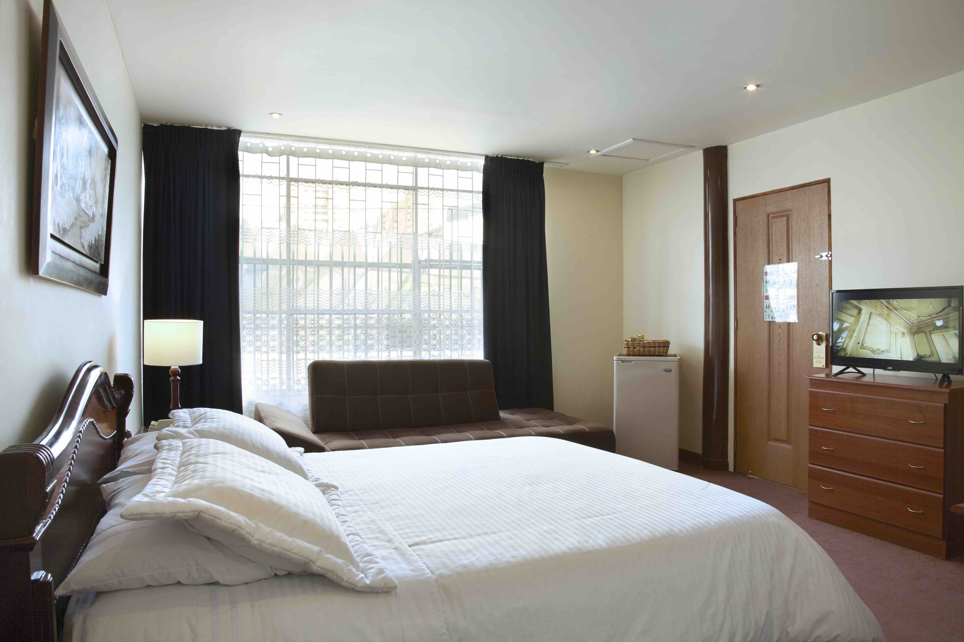 superior room | minibar, in-room safe, desk, iron/ironing board