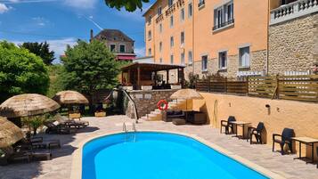 Seasonal outdoor pool, pool umbrellas, pool loungers