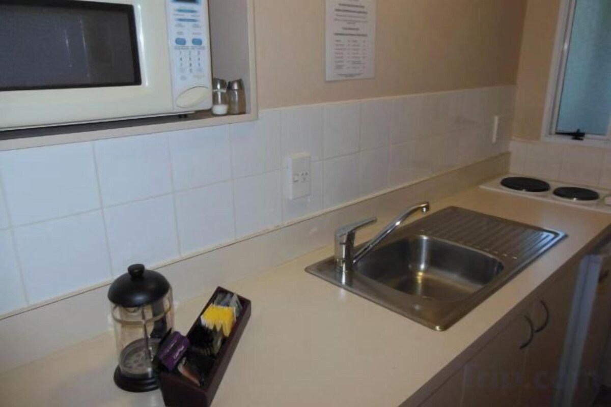 Fridge, microwave, electric kettle, dining table