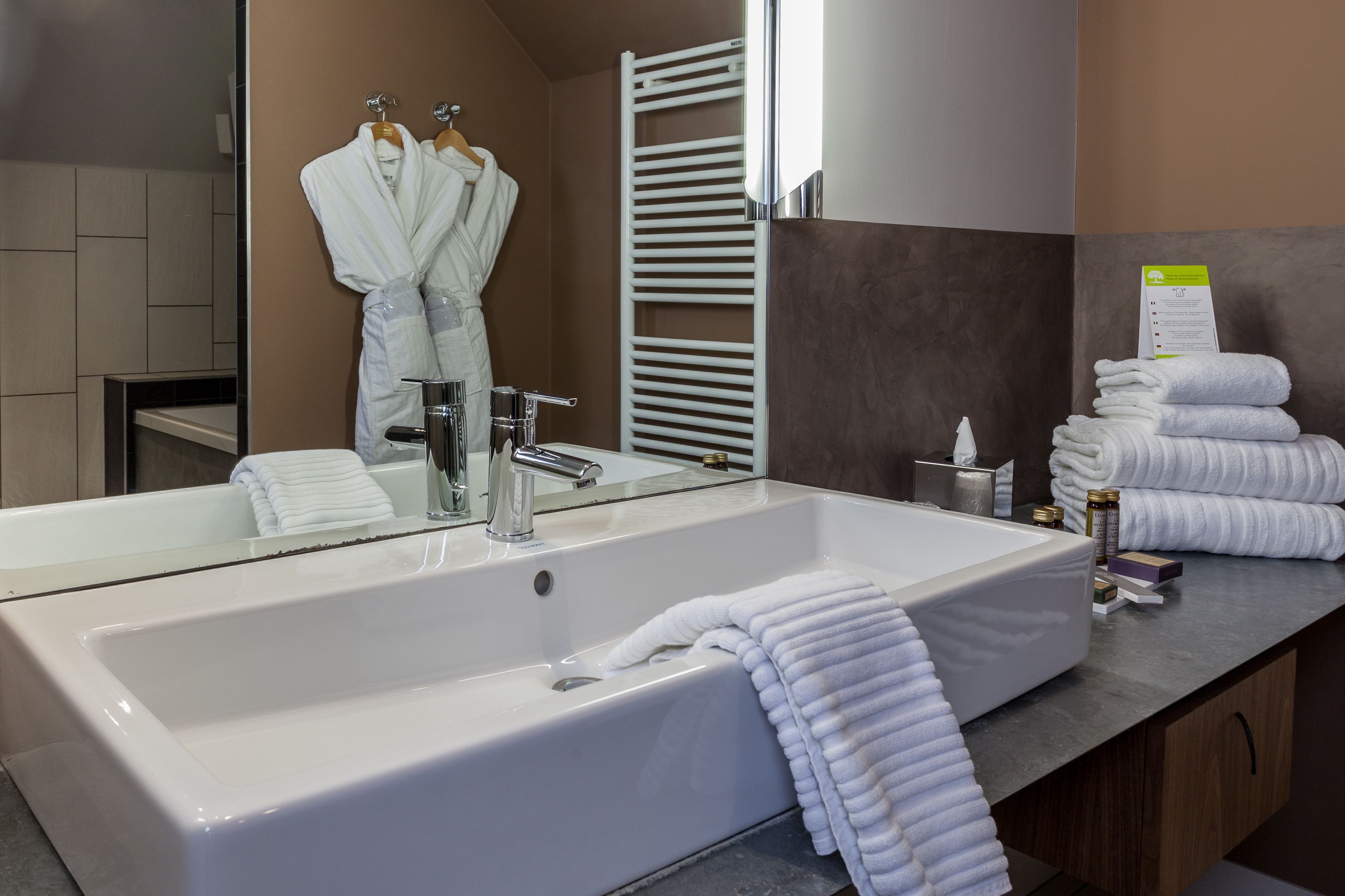 hair dryer, bathrobes, slippers, towels