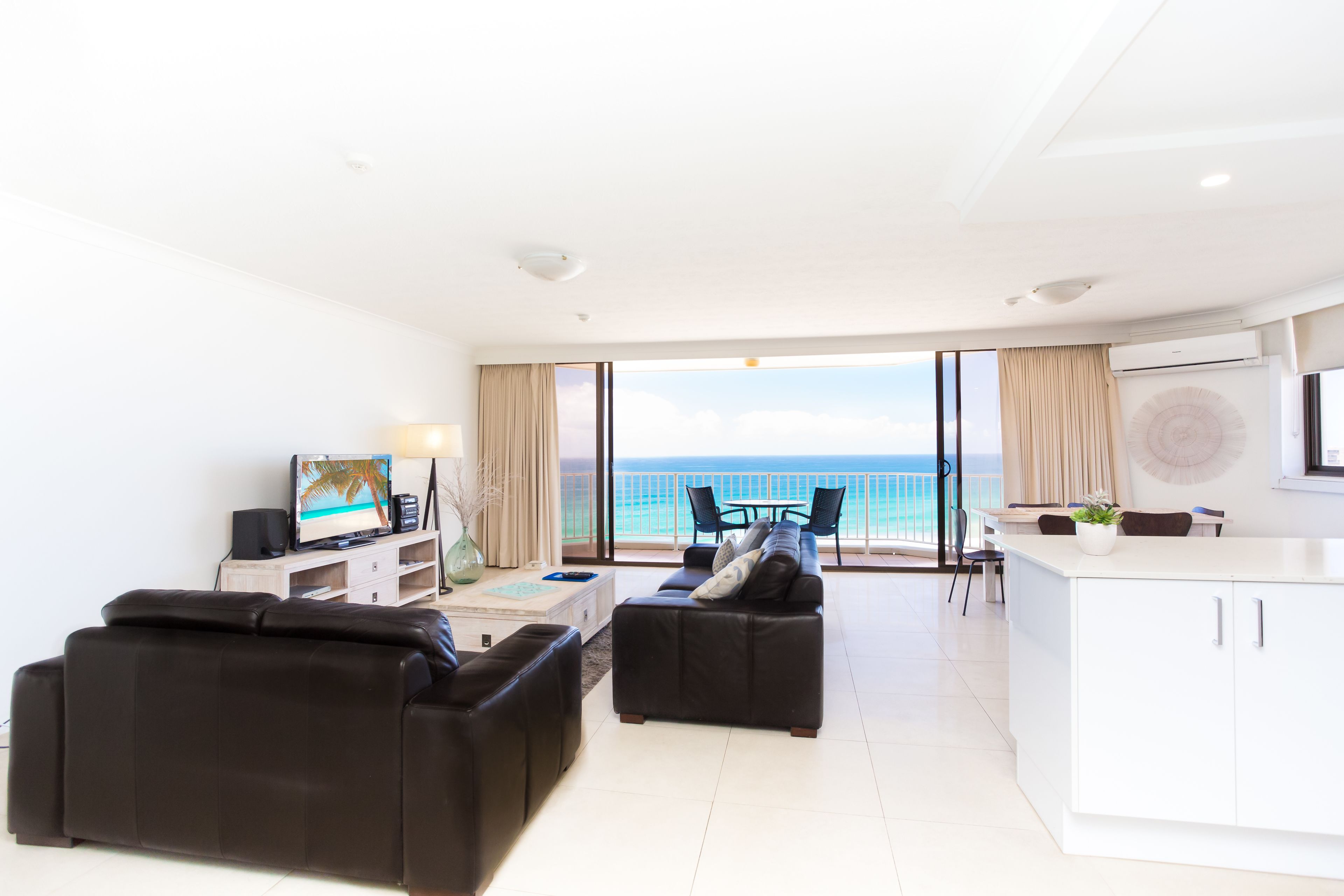 Apartment, 2 Bedrooms, Beachfront | Living area | 30-inch flat-screen TV with cable channels, books