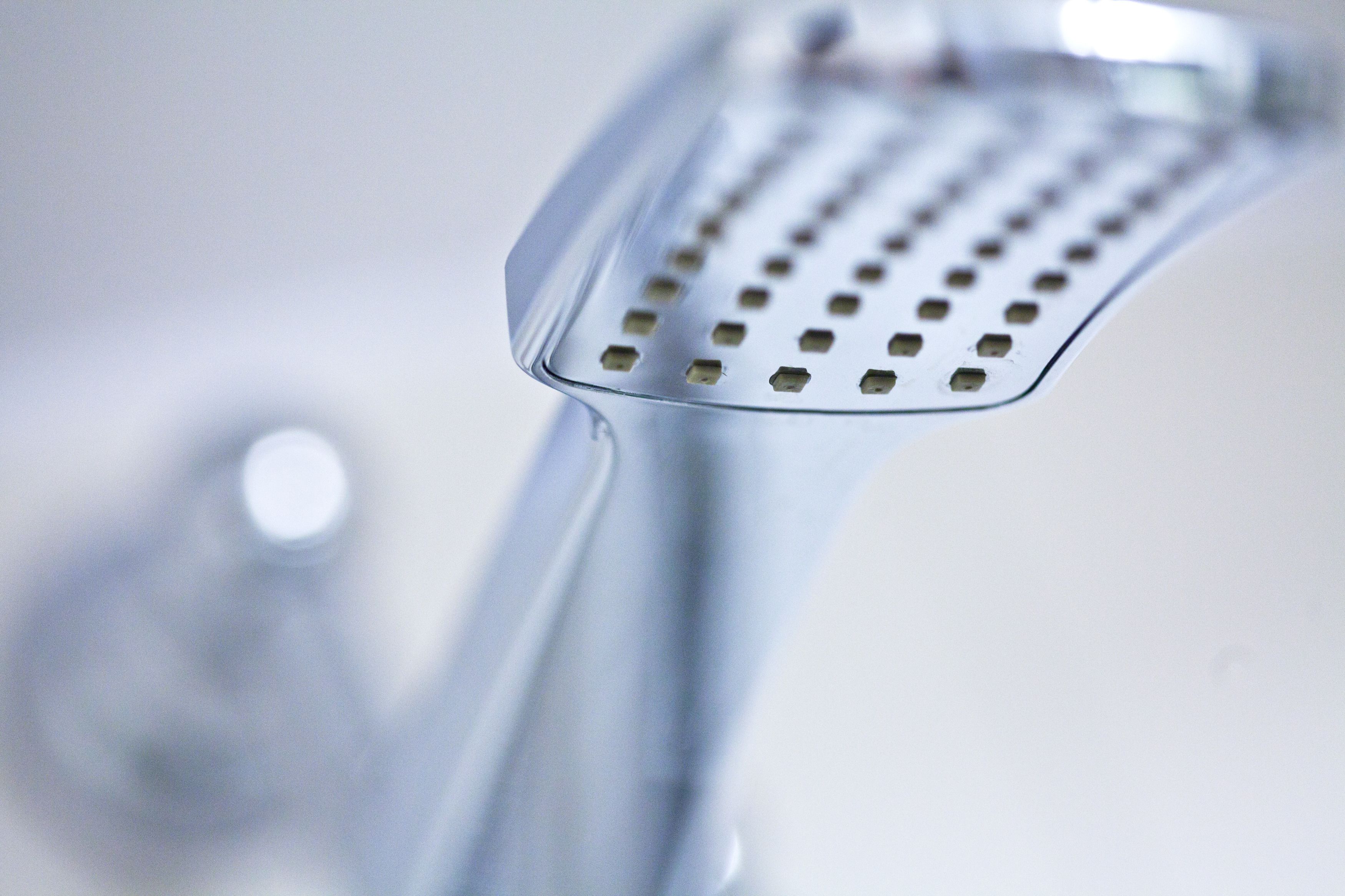 shower, designer toiletries, hair dryer, towels