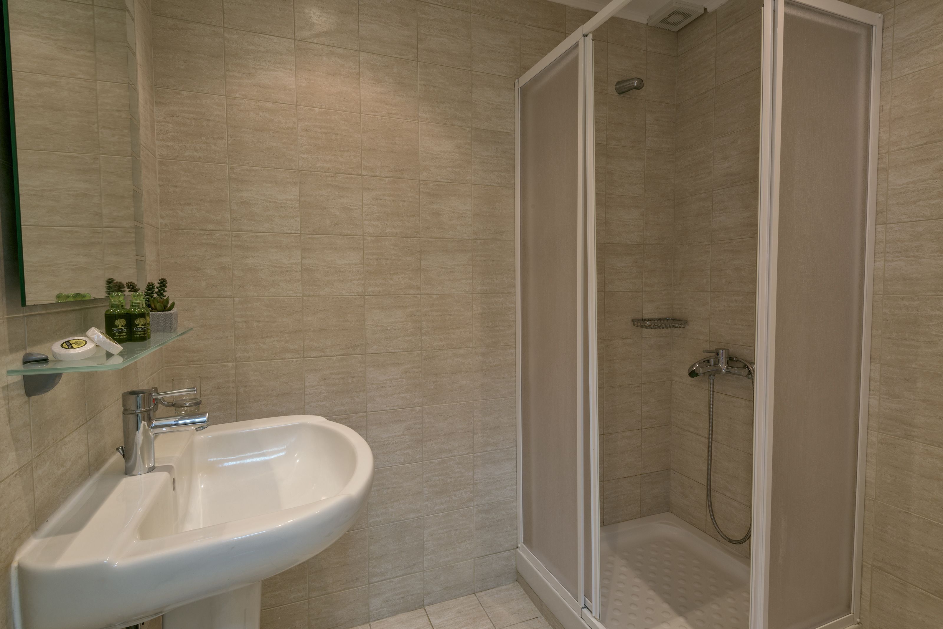 apartment, 2 bedrooms, garden view | bathroom | hair dryer, slippers, towels, shampoo