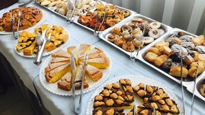 A buffet table with various desserts and pastries. - Monica (Rimini)