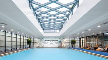 Indoor pool, open 9:00 AM to 9:00 PM, pool loungers