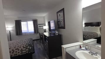 Deluxe Room, 1 Queen Bed, Non Smoking | Desk, laptop workspace, soundproofing, iron/ironing board