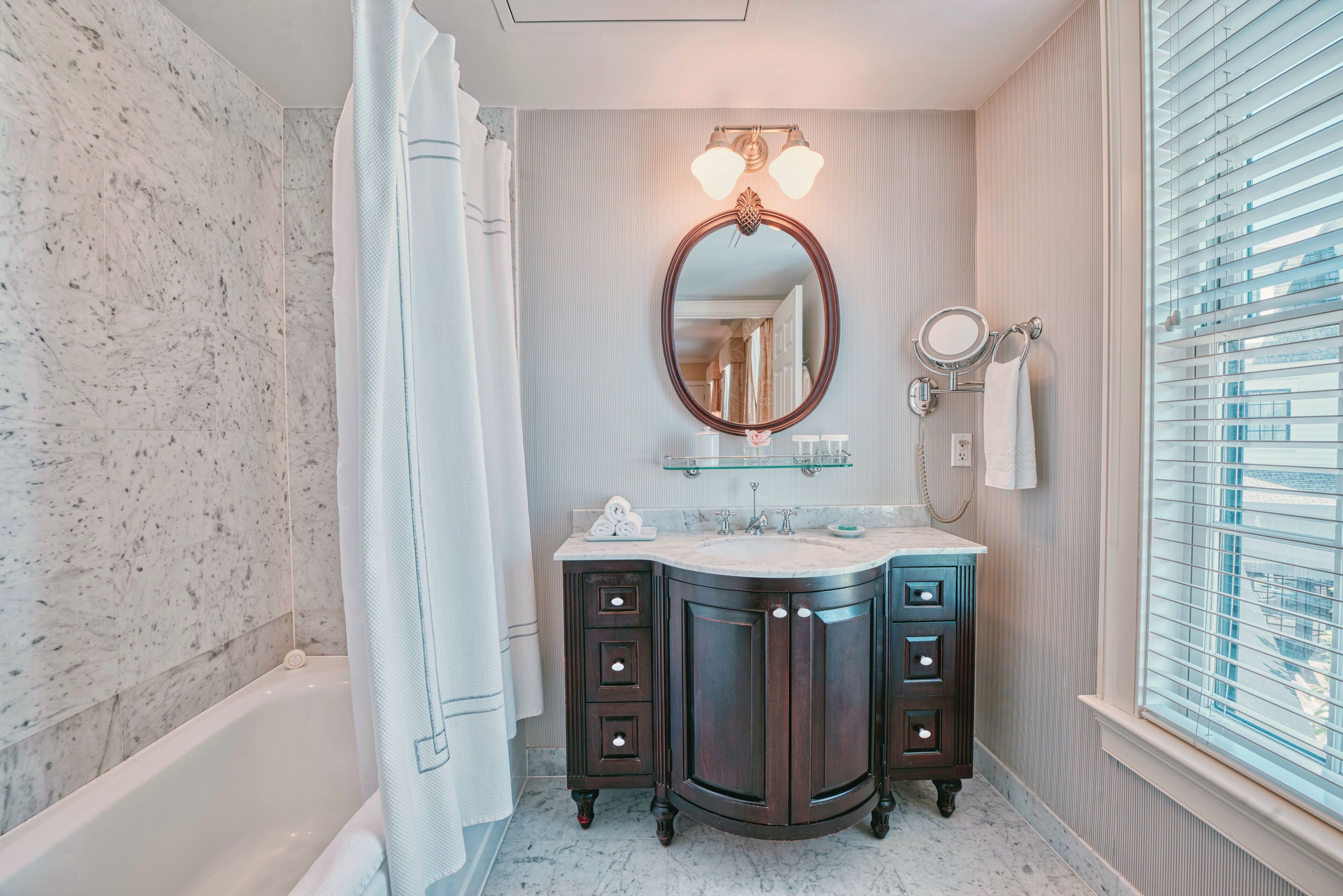 combined shower/bathtub, designer toiletries, hair dryer, bathrobes