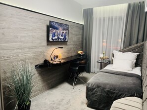 Habitación individual | Ropa de cama de alta calidad y colchones con acolchado adicional
