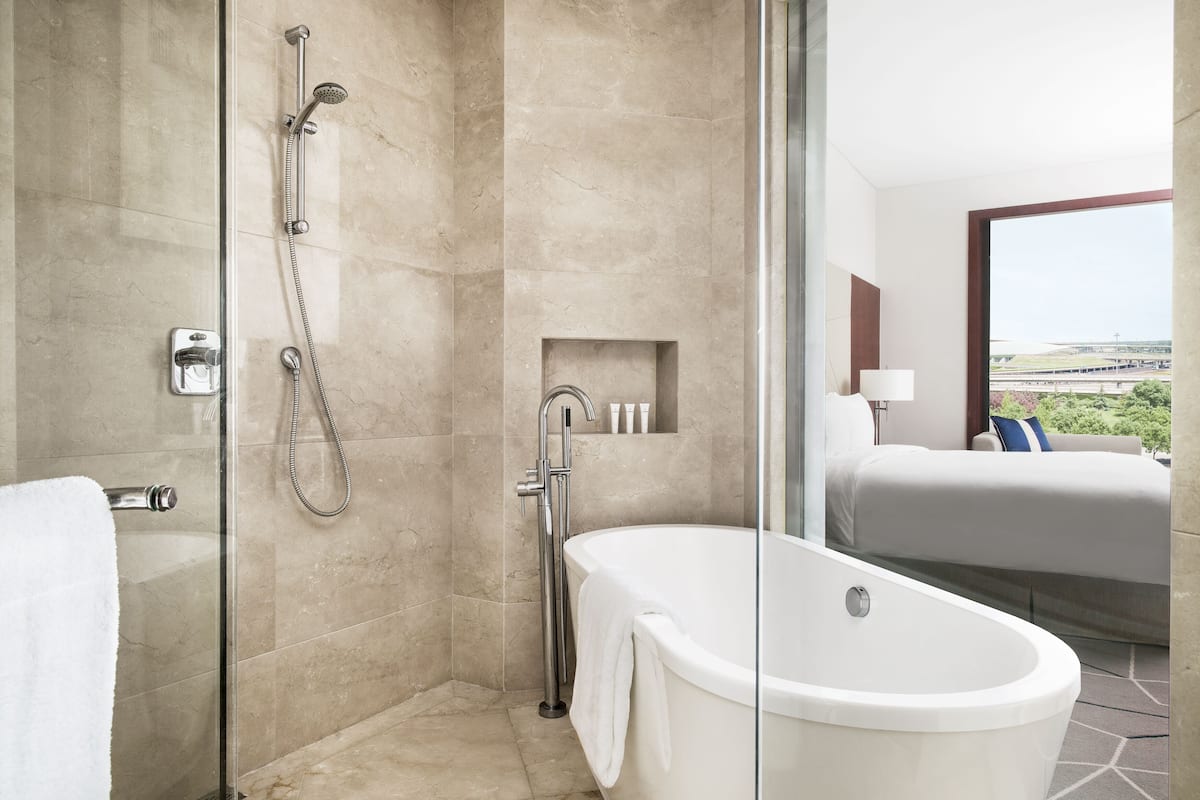 separate bathtub and shower, deep-soaking bathtub, rainfall showerhead