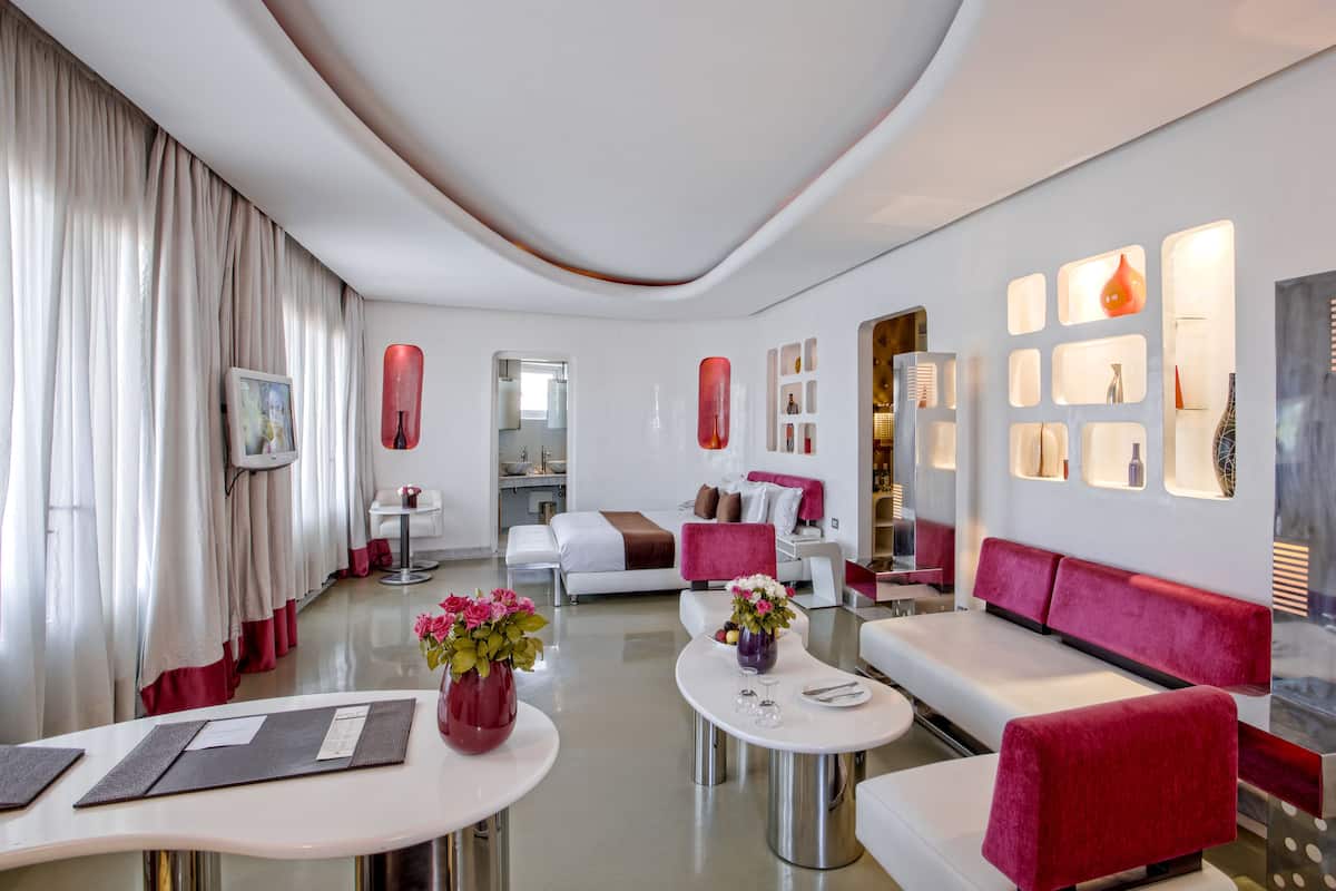 Junior Suite | Living room | 32-inch LCD TV with satellite channels, TV