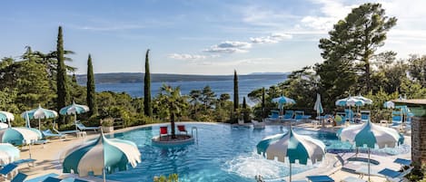 Indoor pool, outdoor pool, pool umbrellas, pool loungers