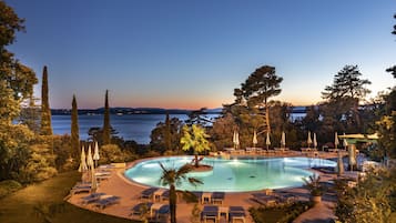 Indoor pool, outdoor pool, pool umbrellas, sun loungers