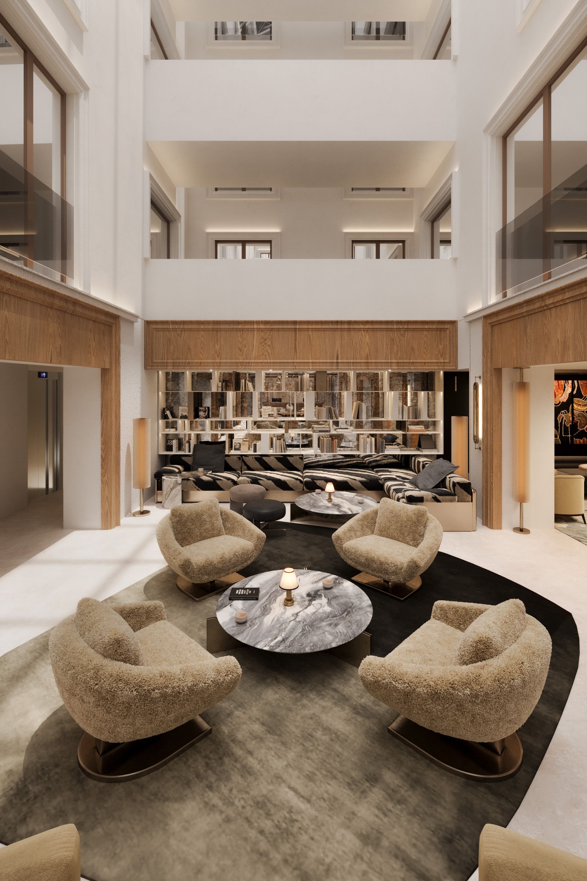 Un intérieur spacieux à plusieurs niveaux, avec un espace salon central agrémenté d’une table basse en marbre, entourée de fauteuils confortables.