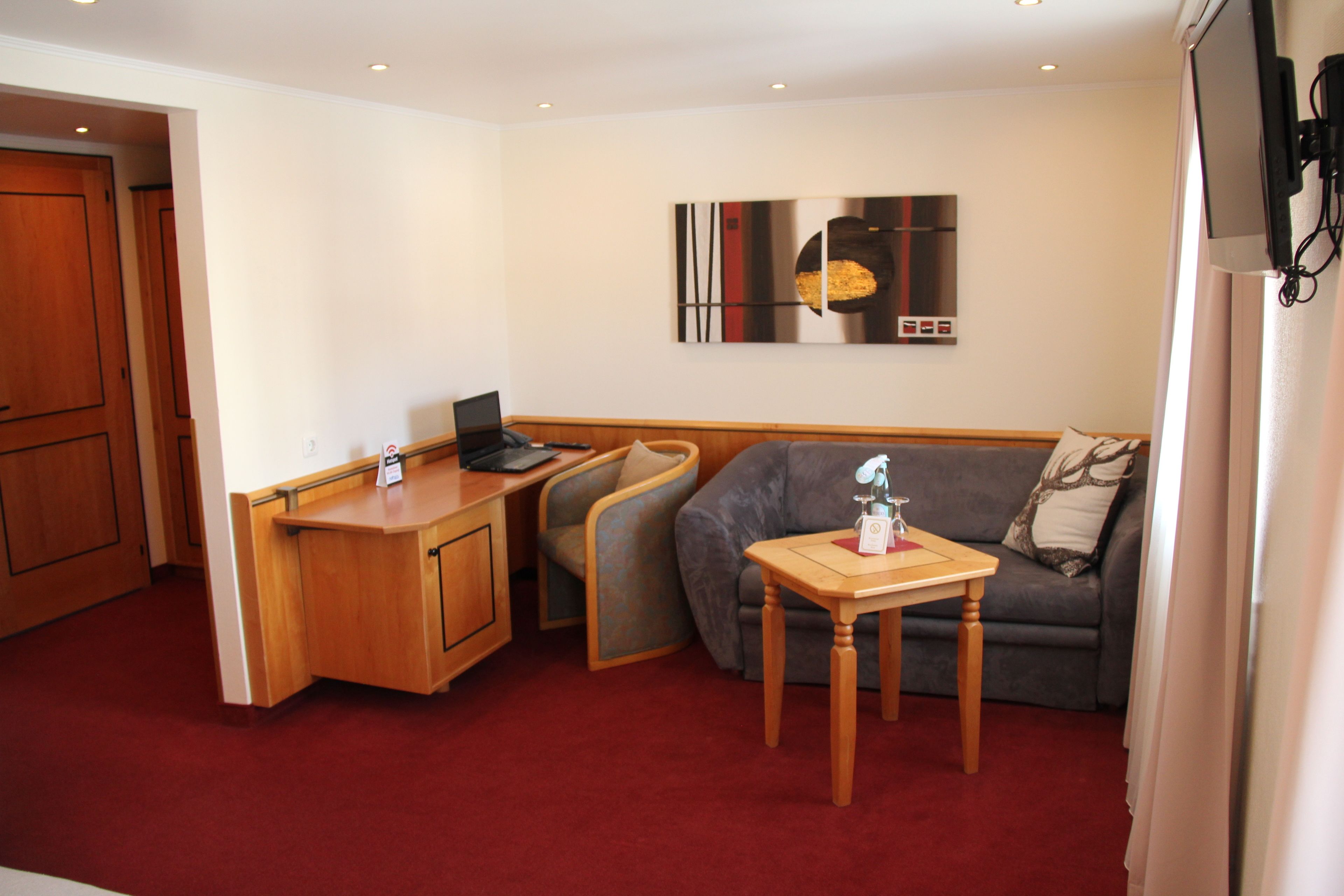 family room | premium bedding, minibar, in-room safe, desk