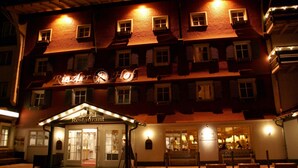 A hotel with a sign reading "Ritz Hotel."