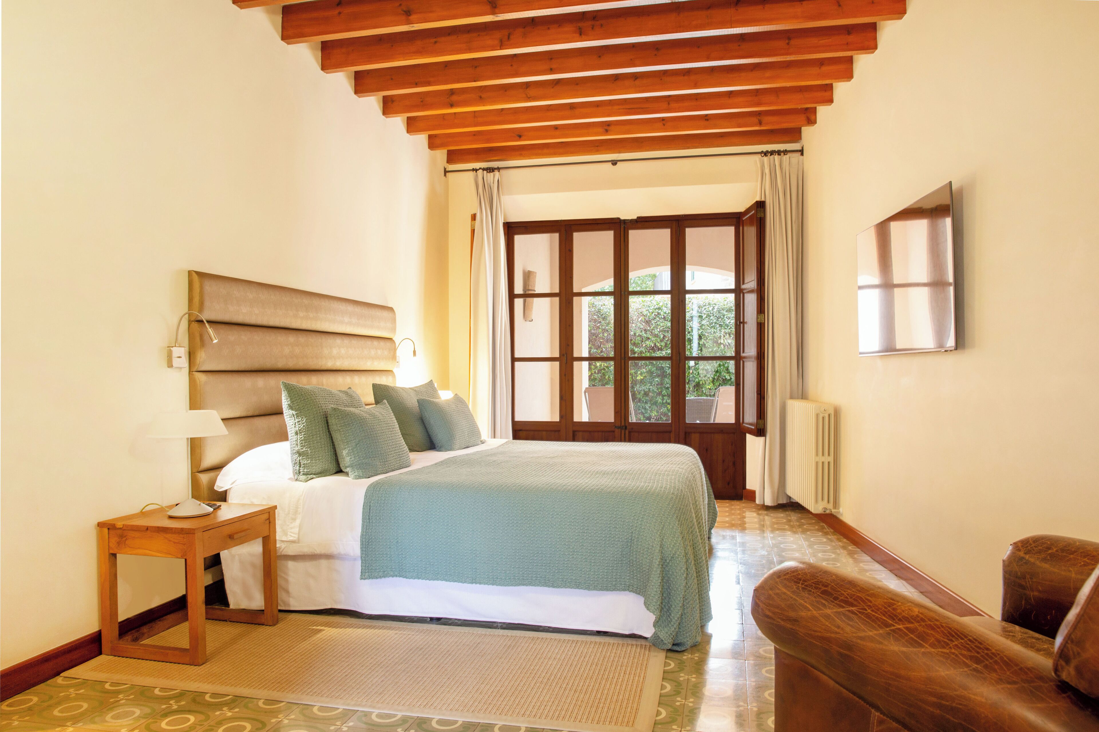 junior suite, terrace, mountain view | in-room safe, individually decorated, individually furnished, desk