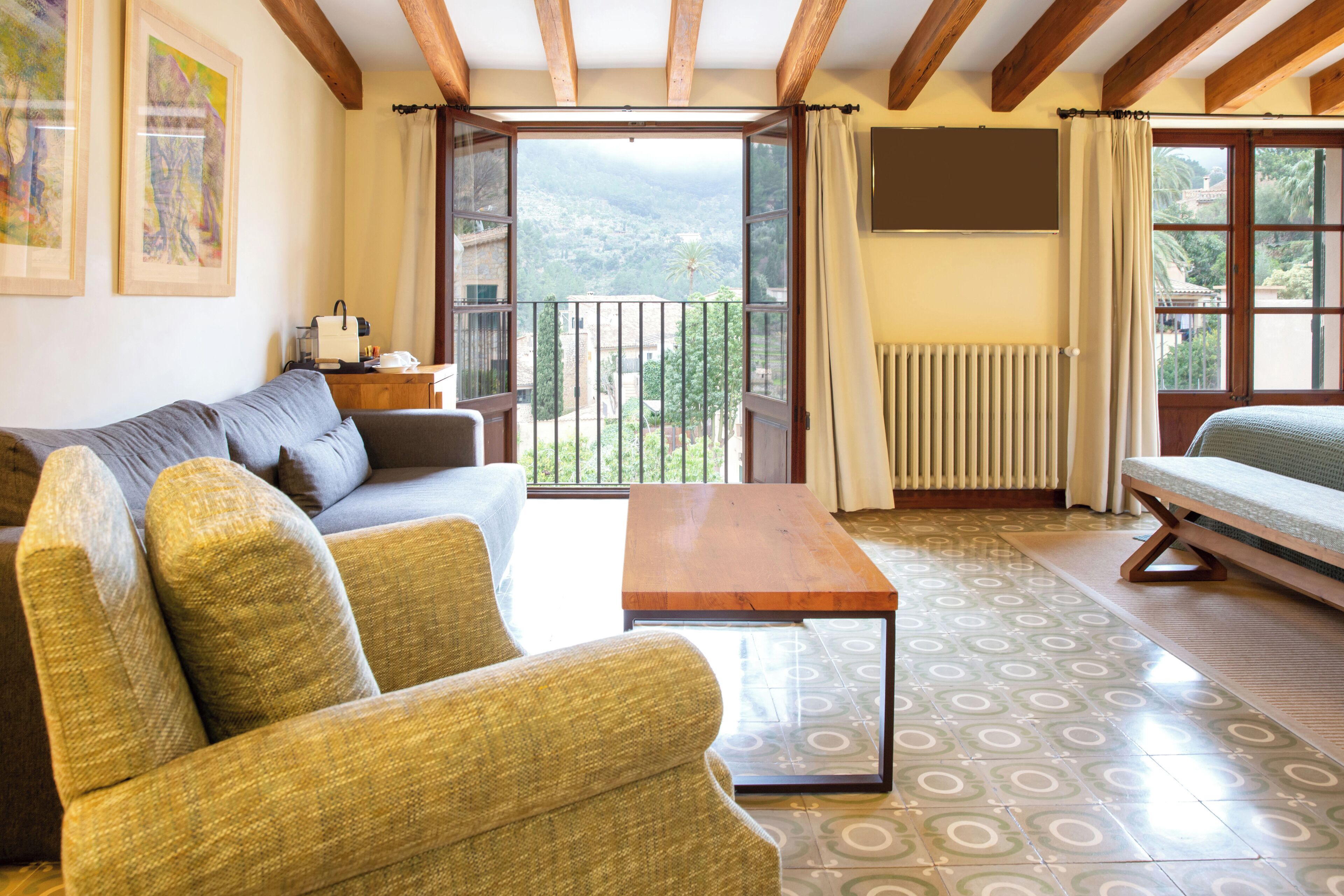 junior suite, terrace, mountain view | in-room safe, individually decorated, individually furnished, desk