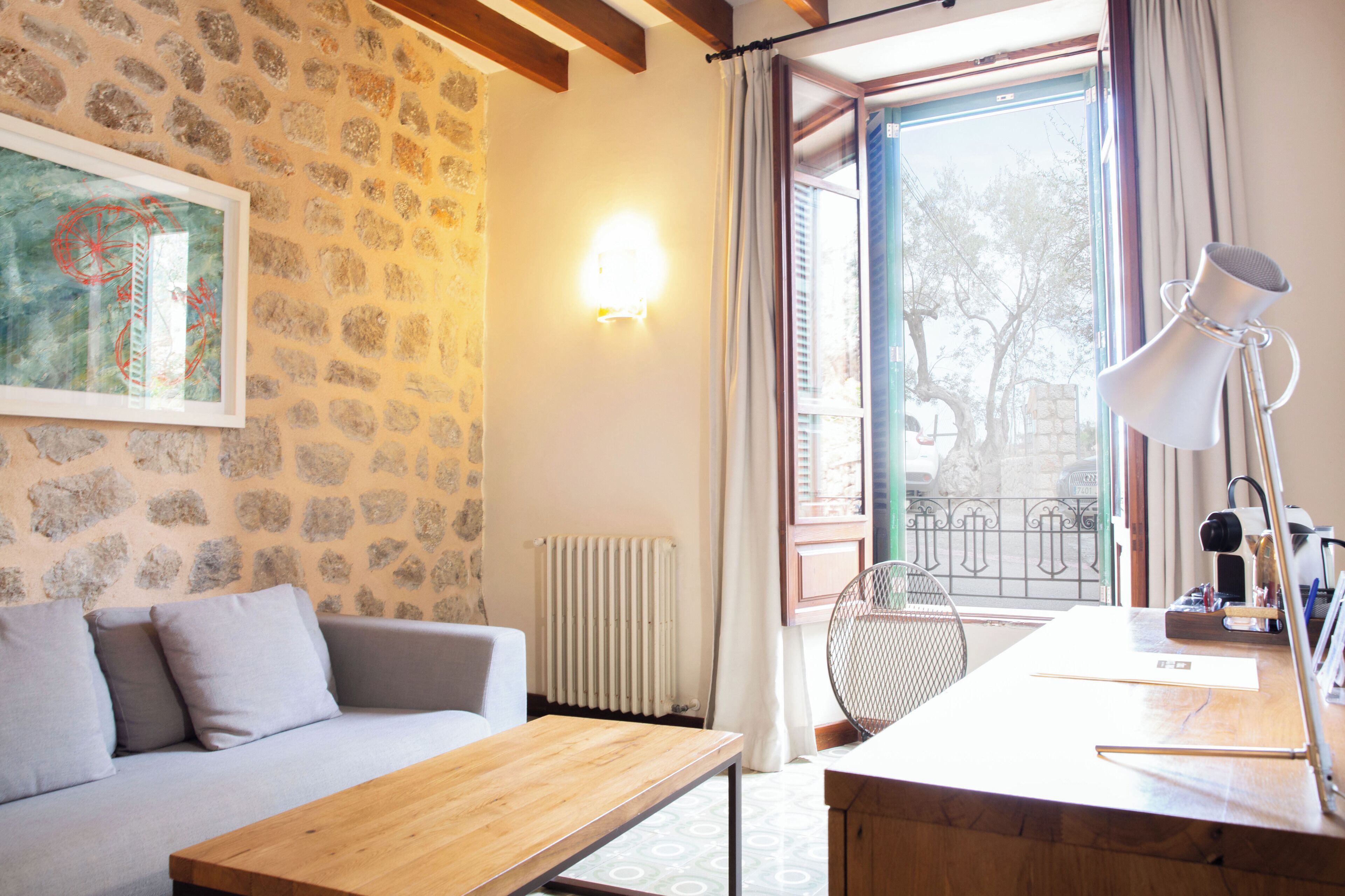 junior suite, terrace, mountain view | living area | flat-screen tv, dvd player