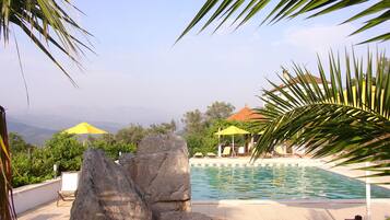 Outdoor pool, pool umbrellas, sun loungers