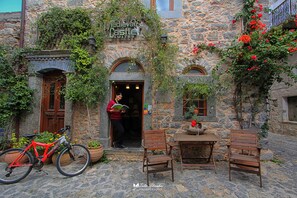 A stone building with a sign reading "Medieval Castle Suites."