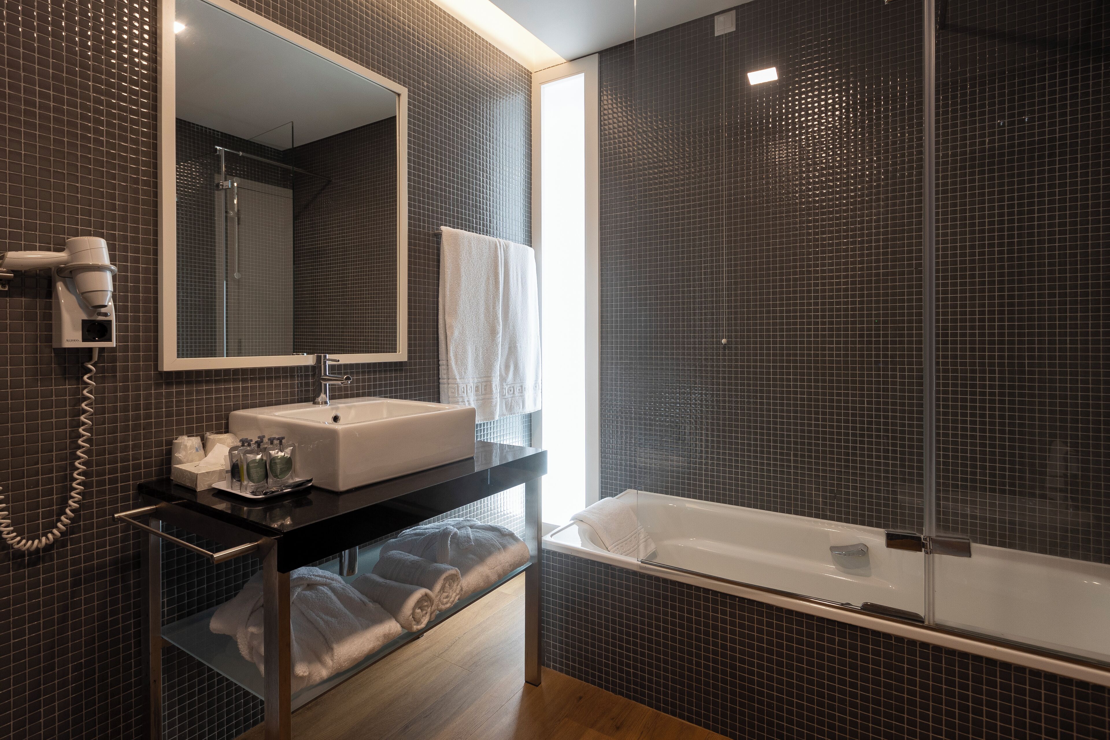 double or twin room, mountain view | bathroom | combined shower/bathtub, rainfall showerhead, designer toiletries