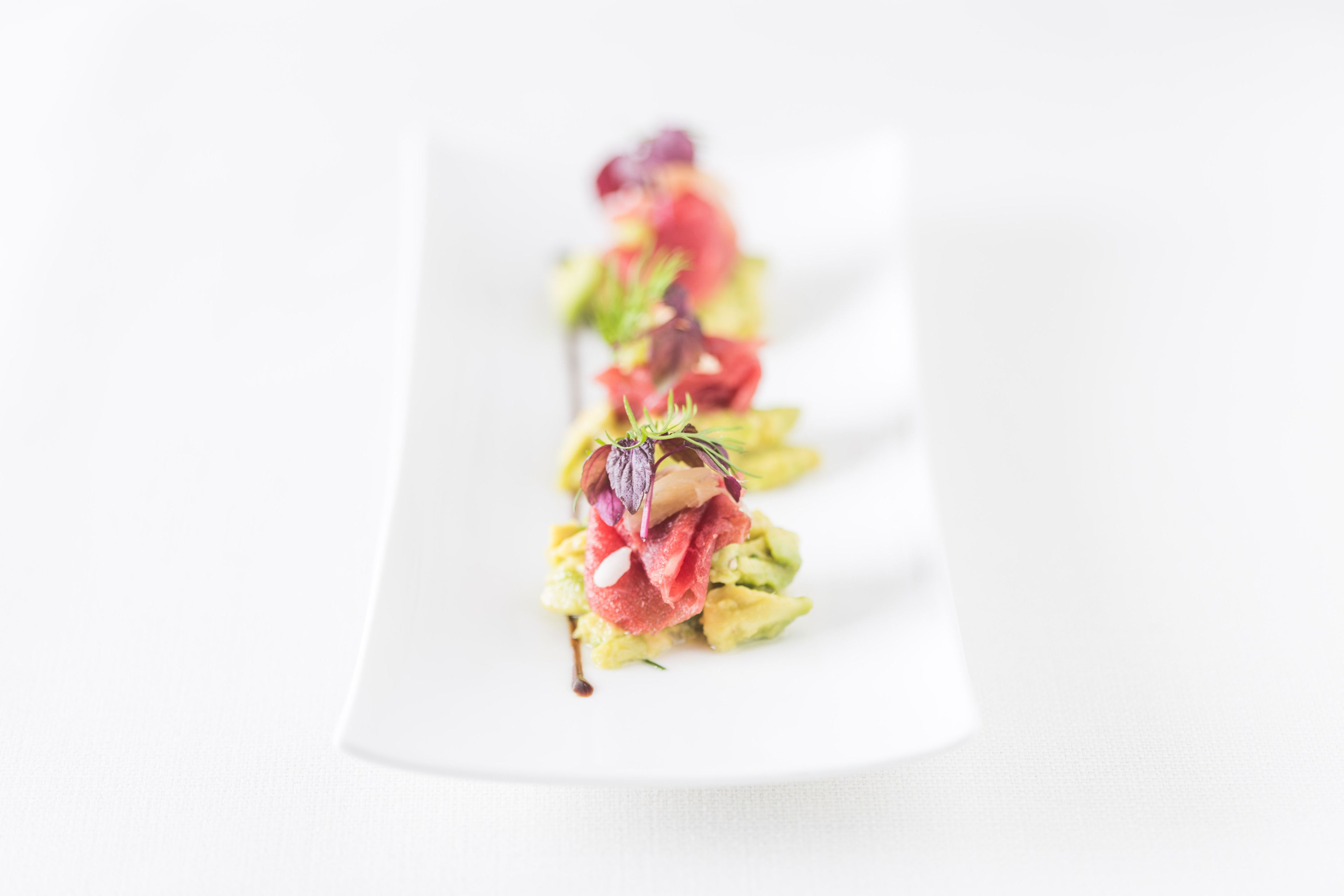 A white plate with a food arrangement.