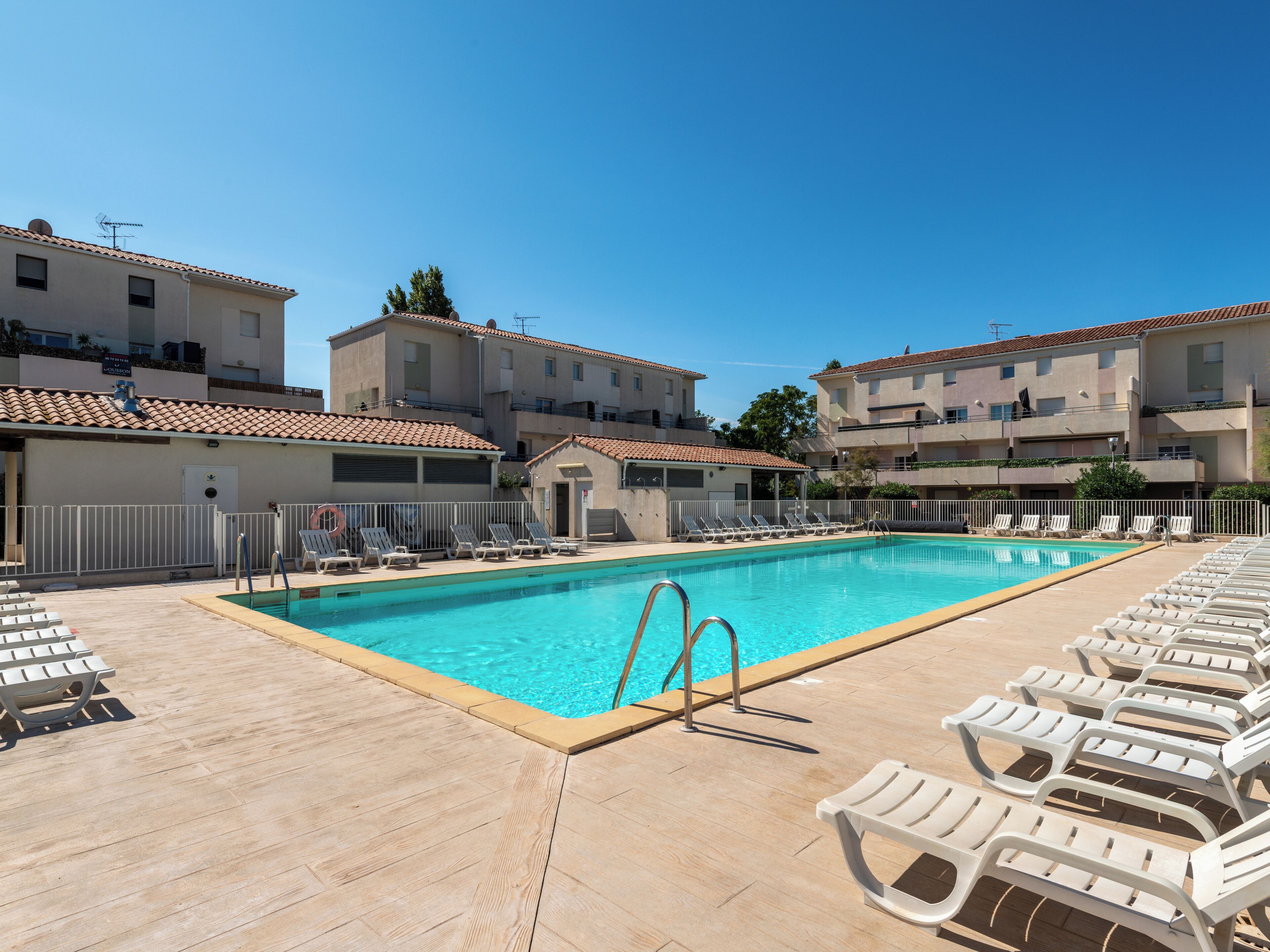 Seasonal outdoor pool, open 10:00 AM to 7:00 PM, pool loungers