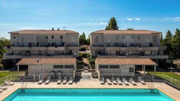 Seasonal outdoor pool, open 10:00 AM to 7:00 PM, sun loungers