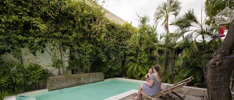 Outdoor pool, open 8:00 AM to 10:00 PM, sun loungers