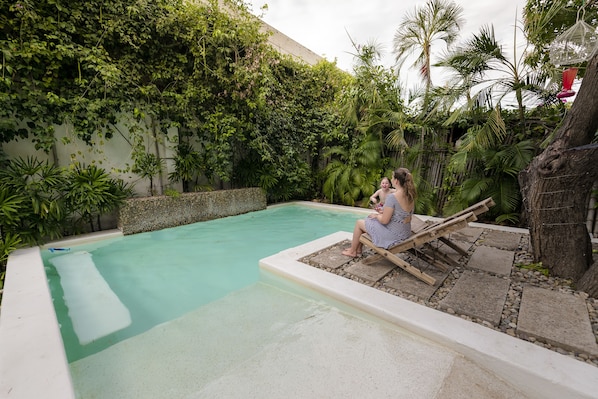 Outdoor pool, open 8:00 AM to 10:00 PM, pool loungers