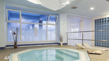 Relax by the pool surrounded by comfortable lounge chairs and towels.