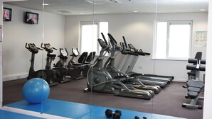 A gym with treadmills, exercise balls, and dumbbells. - Leonardo Hotel Bradford (Bradford)