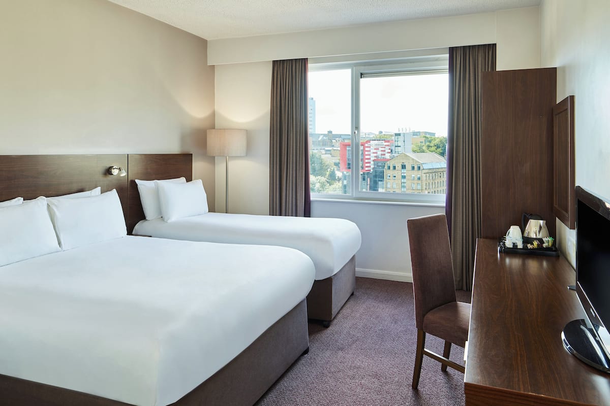 hypo-allergenic bedding, desk, laptop workspace, blackout curtains