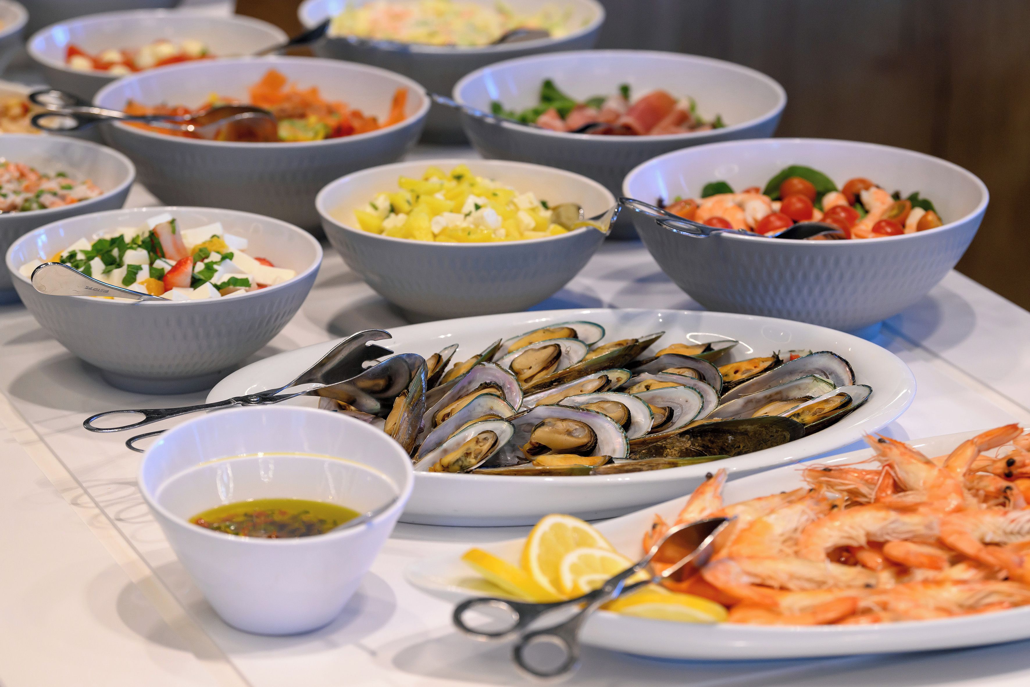 A variety of seafood dishes on a table.