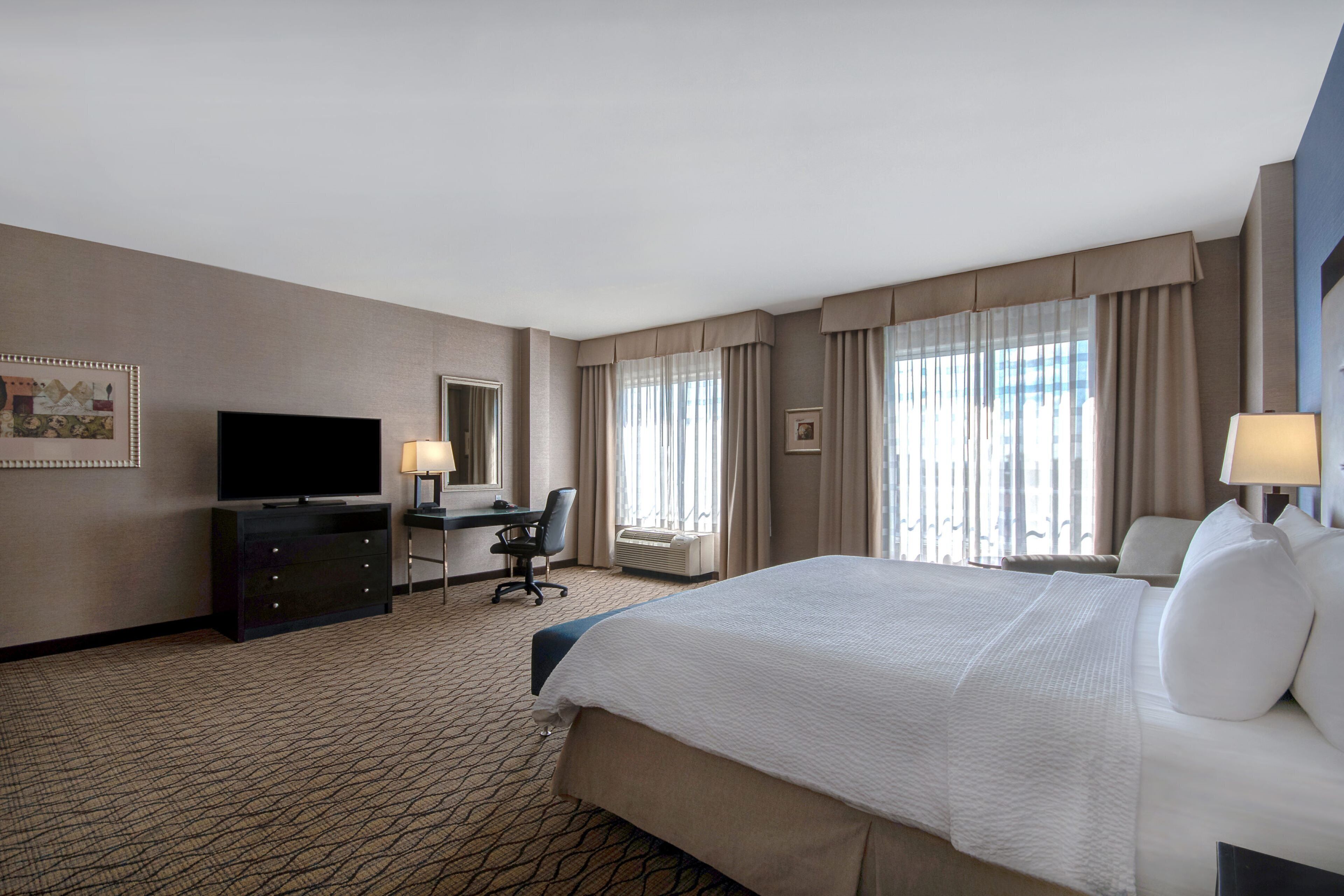 premium bedding, desk, laptop workspace, blackout curtains