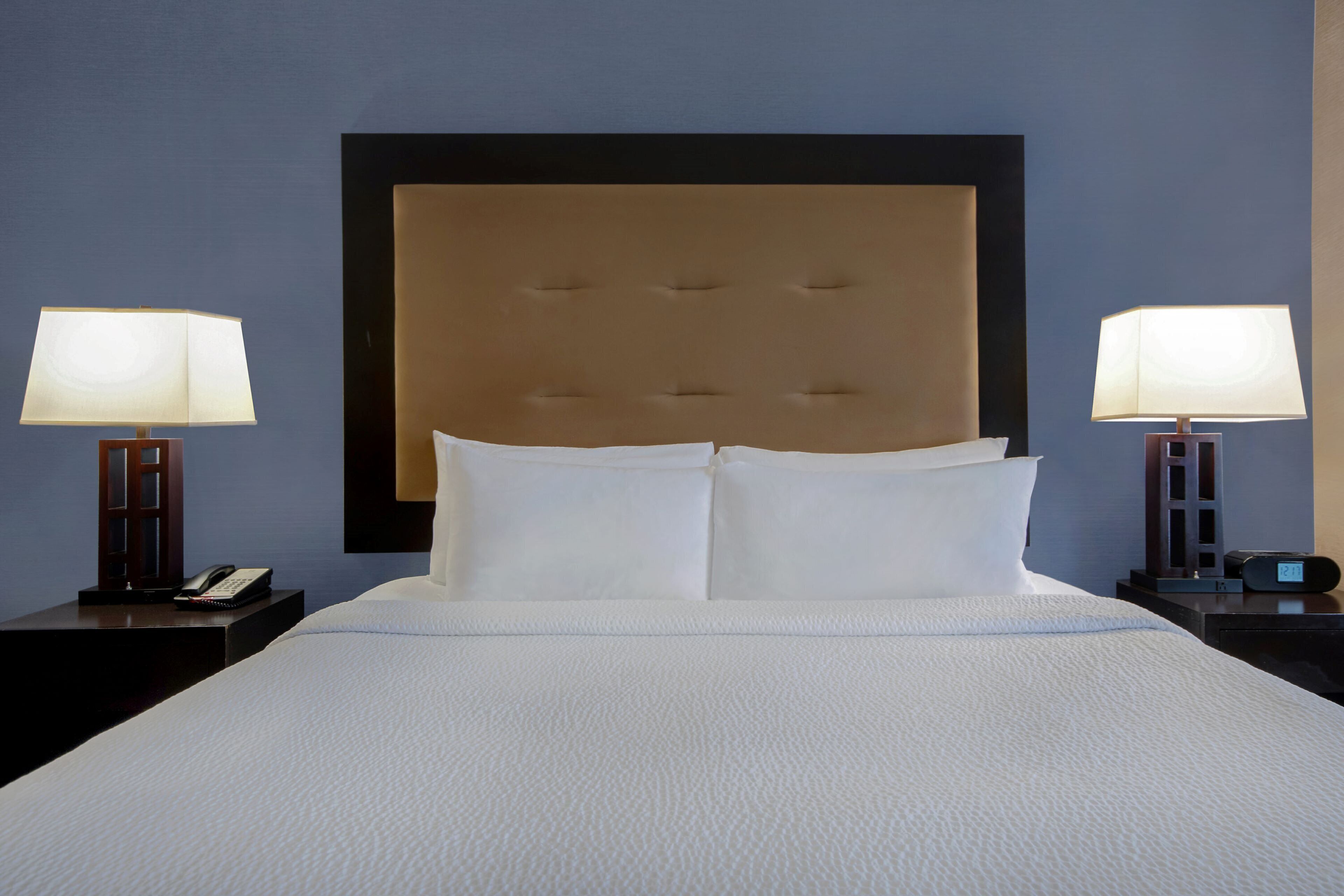 premium bedding, desk, laptop workspace, blackout curtains