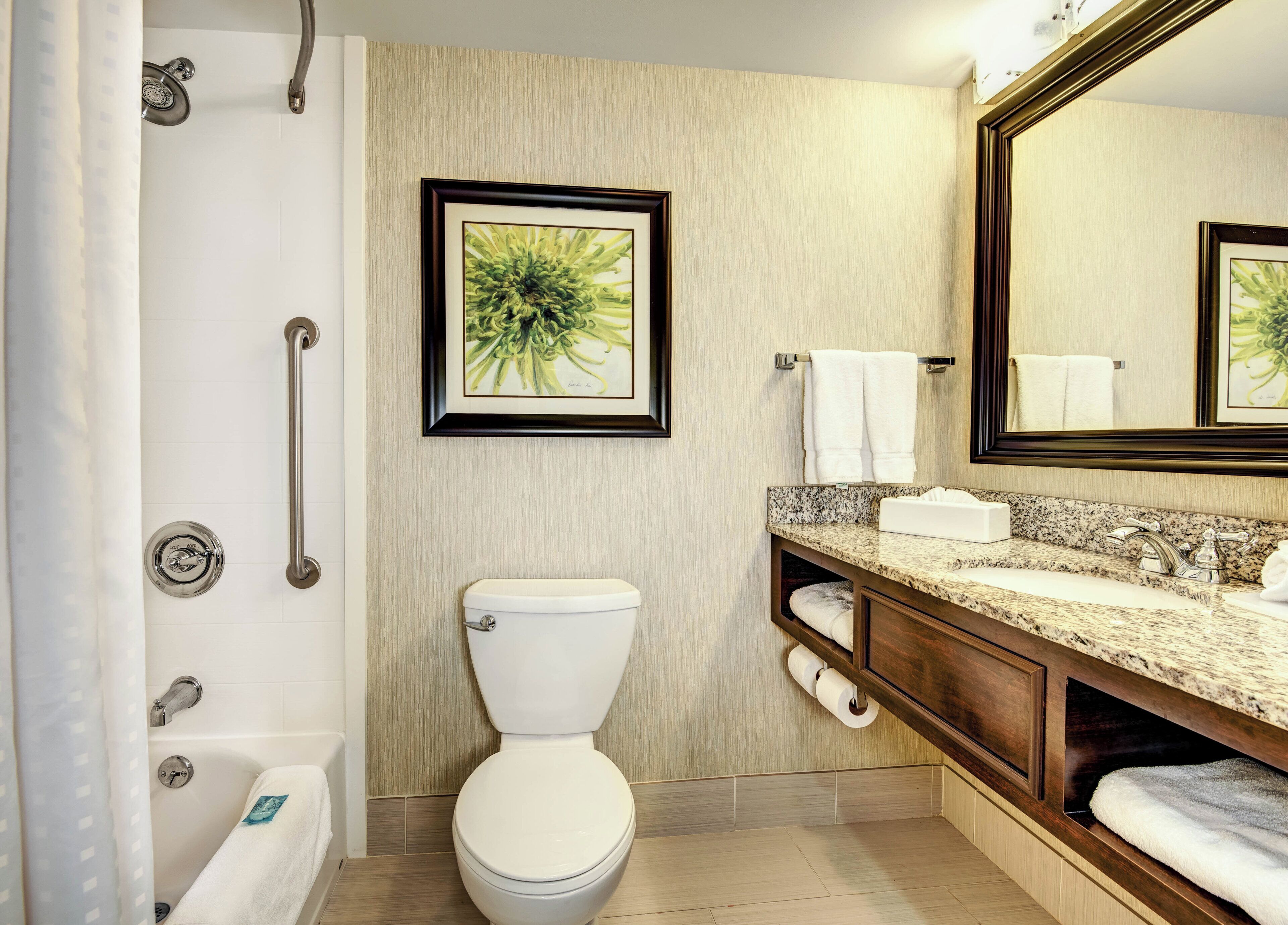 Combined shower/tub, designer toiletries, hair dryer, towels