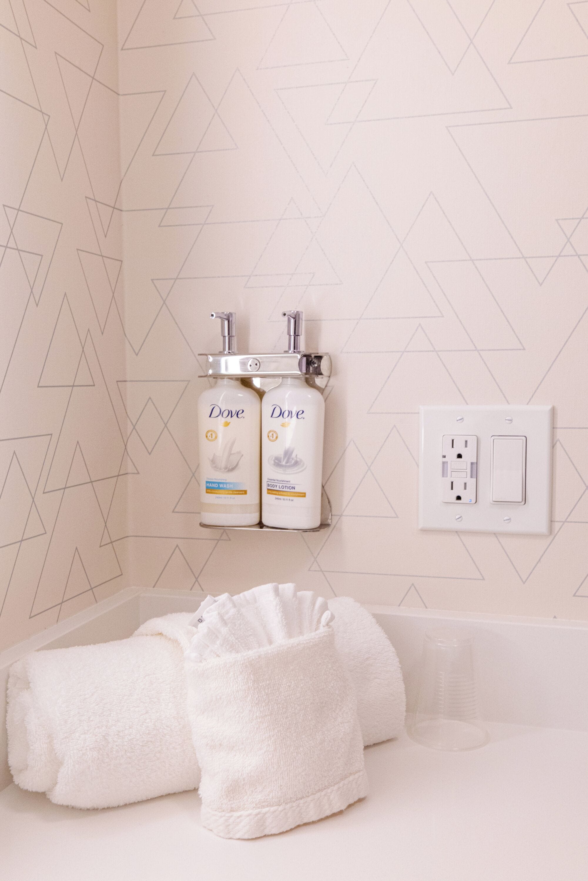 combined shower/bathtub, designer toiletries, hair dryer, towels