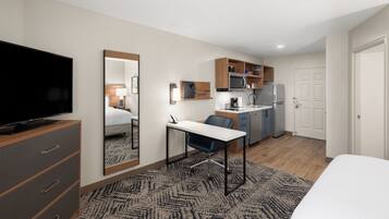 Premium bedding, desk, laptop workspace, iron/ironing board