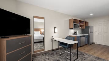 Premium bedding, desk, laptop workspace, iron/ironing board