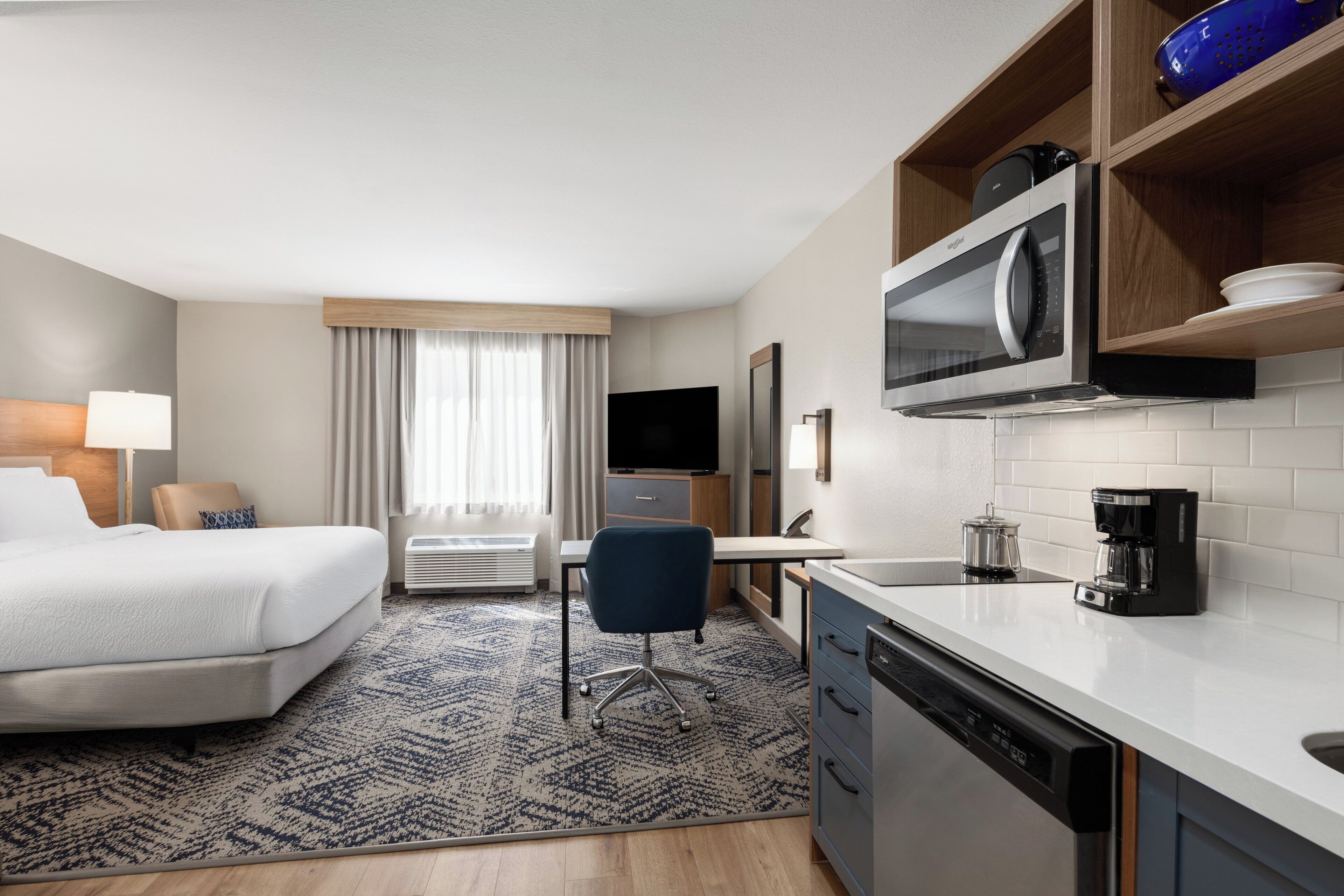 Premium bedding, desk, laptop workspace, iron/ironing board