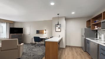Premium bedding, desk, laptop workspace, iron/ironing board