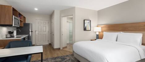 Premium bedding, desk, laptop workspace, iron/ironing board