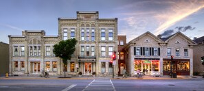 A historic building with a prominent entrance, large windows, and a street view. - Washington House Inn (Cedarburg)