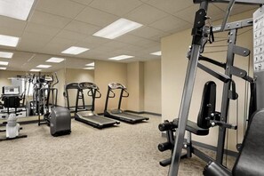 A gym with treadmills, weight machines, and a mirror. - Baymont Inn And Suites Ft. Leonard/saint Robert (St. Robert)