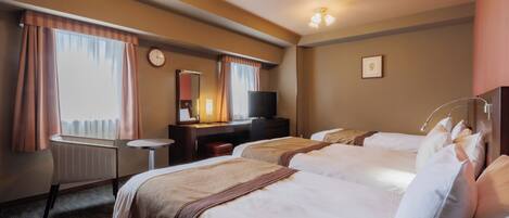 A hotel room with two beds, a desk with a chair, a television, a clock, and a framed picture on the wall.