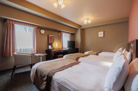 Triple Room, Non Smoking (2 Single + 1 Extra bed) | Down comforters, desk, free WiFi, bed sheets. Hotel Monte Hermana Sendai